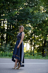 Poster - Vertical shot of a beautiful woman posing on a street