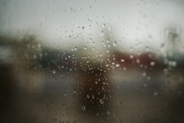 Sticker - Closeup shot of window glass with raindrops on it