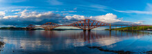 A View From The Harbour At Queensferry Towards The Railway Bridge Over The Firth Of Forth, Scotland On A Summers Day