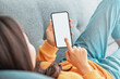 © oatawa - Close up of woman hand using smart phone with blank copy space white screen background for create content.