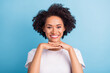 © deagreez - Portrait of young cheerful smiling african girl showing perfect teeth stomatology treatment isolated on blue color background
