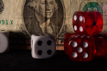 Poster - Closeup shot of red and white dices in front of paper money