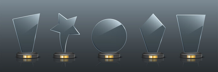 award trophy set. star and rectangle shaped glass prize statues on gray background. champion glory i