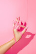 © ADDICTIVE STOCK - Crop model with pink paint flows on hand
