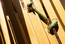 Jade Roller On Wooden Bench