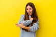 © Asier - Young caucasian woman isolated on yellow background massaging elbow, suffering after a bad movement.