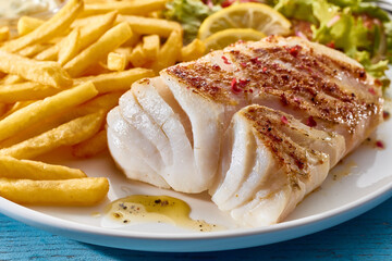 Sticker - Appetizing baked fish fillet served with potato fries