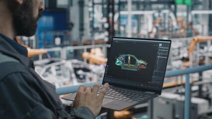 Leinwandbilder - Car Factory Engineer in Work Uniform Using Laptop Computer with Digital 3D CAD Vehicle Blueprint. Male Specialist in Automotive Industrial Manufacturing Facility Working on Automobile Production.
