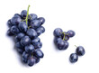 © Denis Petrovskikh - Bunch of ripe dark blue grapes isolated on white background. View from above.