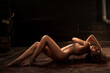© Aikon - Beautiful nude woman chained on floor looks away