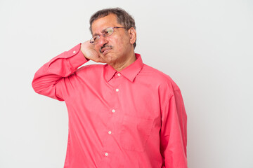 Wall Mural - Middle aged indian man isolated on white background tired and very sleepy keeping hand on head.