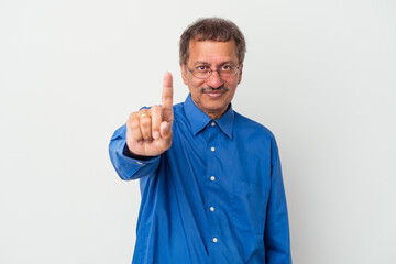 Wall Mural - Middle aged indian man isolated on white background showing number one with finger.