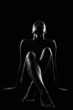 © eugenepartyzan - Female silhouette. Nude Woman in the dark