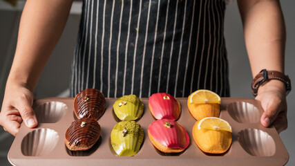 Wall Mural - French traditional madeleine biscuits with 4 type of madeleines, Food concept background.