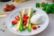 Burrata cheese with asparagus and strawberries