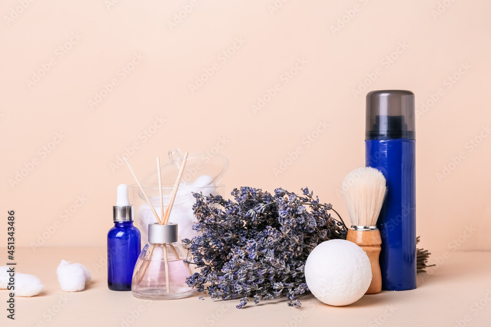 Composition with bath supplies and lavender flowers on color background