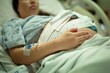 © globalmoments - A pregnant woman being induced in the hospital, with iv and contractions monitor.