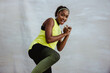 © Jacob Lund - African fitness woman doing kick boxing workout