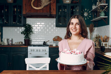 Young Woman With Dessert White Cake Sit At Kitchen.