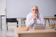 © Elnur - Old male chemist teacher in the classroom