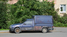 Old Blue Rusty Broken Pickup Truck In The Courtyard Of A Residential Building, Babushkina Street, St. Petersburg, Russia, August 2021