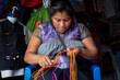 Mexican craftswoman weaving by hand to sell hers products