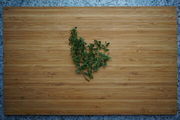 Lemon thyme on wooden board