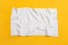 Crumpled White Beach Towel On Yellow Background, Top View
