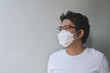© NAPAPORN - Asian men wearing mask for protect coronavirus, PM2.5 dust and air pollution  concept.