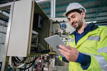 Wall Mural - professional technician engineer working to control electrical power and safety service system, electrician working to maintenance and checking industrial equipment in term of factory technology