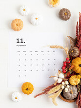 Flat Lay With Calendar For November With Autumn Table Decoration