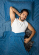© Narayan - latin man playing in bed with his friend dog, sleep concept