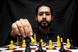 © Narayan - latin man with beard challenging in chess game, chess concept