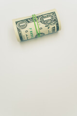 Sticker - Roll of dollar paper bills isolated on a white background with free space for text