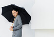 Asian woman holing umbrella on white background