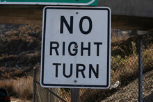 No Right Turn Sign On The Side Of The Road Late In The Afternoon