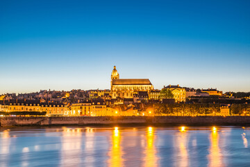 Wall Mural - Cityscape of Blois with Cathedral over Loire river France at dusk