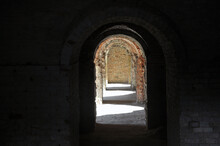 A Through Corridor Through The Casemates Of The Defensive Barracks In The Rays Of Sunlight. Artistic Noise
