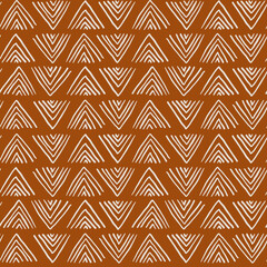 Ethnic brush stroke mud cloth fabric pattern. African boho seamless vector pattern in brown and beige, tribal.