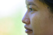 © nuttapon - Side face of Asian woman no makeup