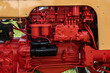 Canandaigua NY Steam Engine Association Pageant of Steam on Saturday, Aug 14, 2021. A bright Orange engine With a Black part stands out in this antique tractor engine in Upstate NY	
