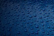 Water drops on metal on car paint. Hydrophobic effect on metal surface