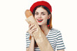 Frenchwoman in a striped T-shirt red hat Gourmet snack food diet