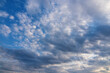 White clouds over blue sky background. Vivid view of natural scene at sunny day.
