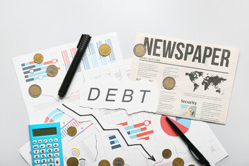 Poster - Word DEBT with charts, coins and stationery on light background