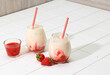 Fresh Korean Strawberry Milk with Homemade Strawberry Compote Sauce on White Background, Copy Space for Text