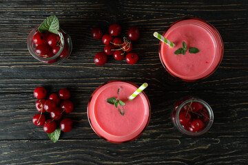 Wall Mural - Cherry smoothie and ingredients on rustic wooden table