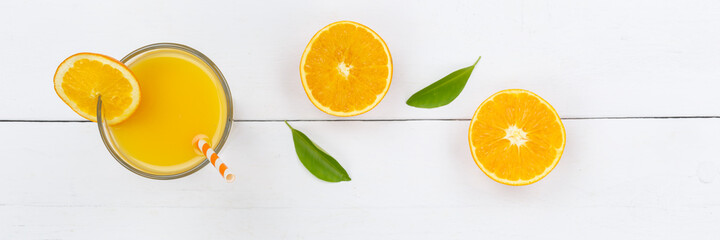 Wall Mural - Orange juice drink on wooden board from above panorama