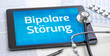Ein Tablet mit dem Text Bipolare Störung auf dem Display