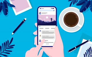 Fototapete - Using social media at home - Hand holding phone and checking SOME with table in background. Top view vector illustration